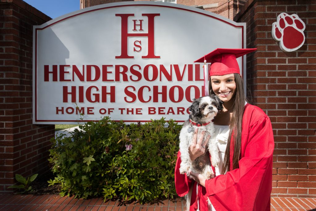 High school senior in cap and gown during a Blue Ridge Expressions studio portrait session in Mills River.